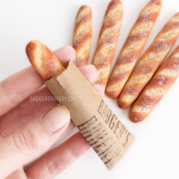 https://www.badgersbakery.com/cdn/shop/products/baguettes_dollhouse_miniature_bread_05_grande.jpg?v=1631970641