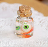 2 eyeballs specimen jar, green