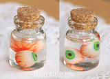 2 eyeballs specimen jar, green