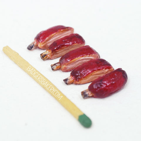 https://www.badgersbakery.com/cdn/shop/products/ribs_dollhouse_miniature_food_spare_02_large.jpg?v=1459525020